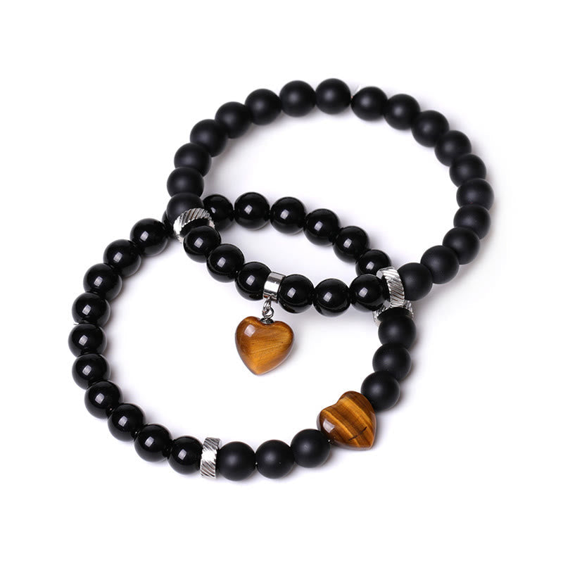 Armband Schwarzer Onyx Kristall Paar mit Tigerauge Herzanhänger elastisch.