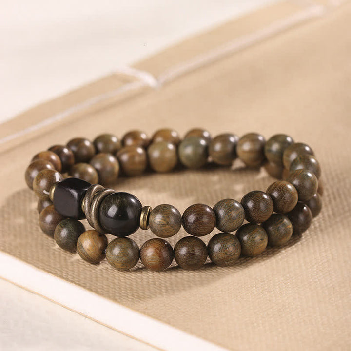 Armband Sandelholz Kristall – Frieden mit schwarzem Obsidian elegant.
