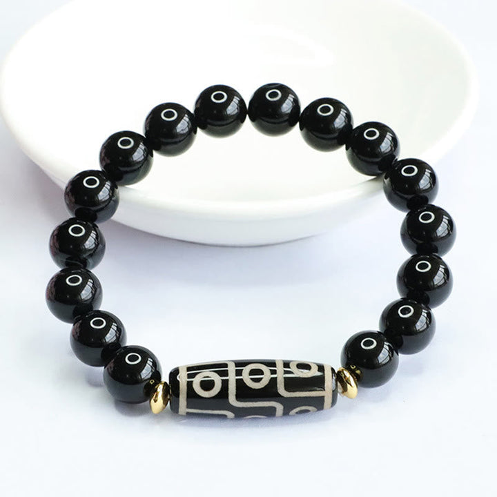 Armband Schwarzer Onyx mit graviertem Tibetan-Dzi Perlen elegant.