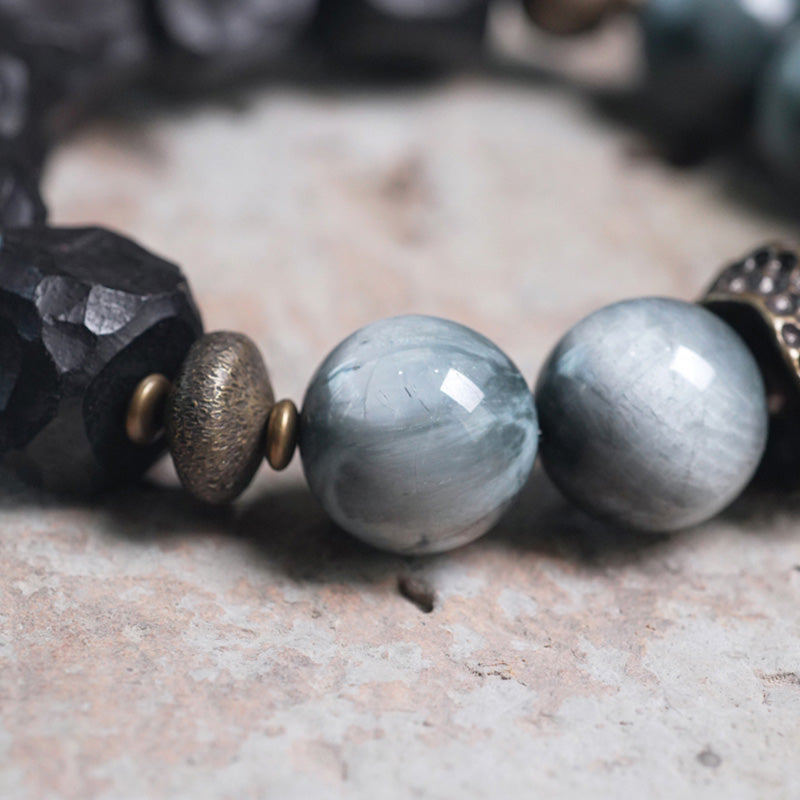 Armband Kupfer Ebenholz Paar mit grauen Steinkugeln elegantes Design.