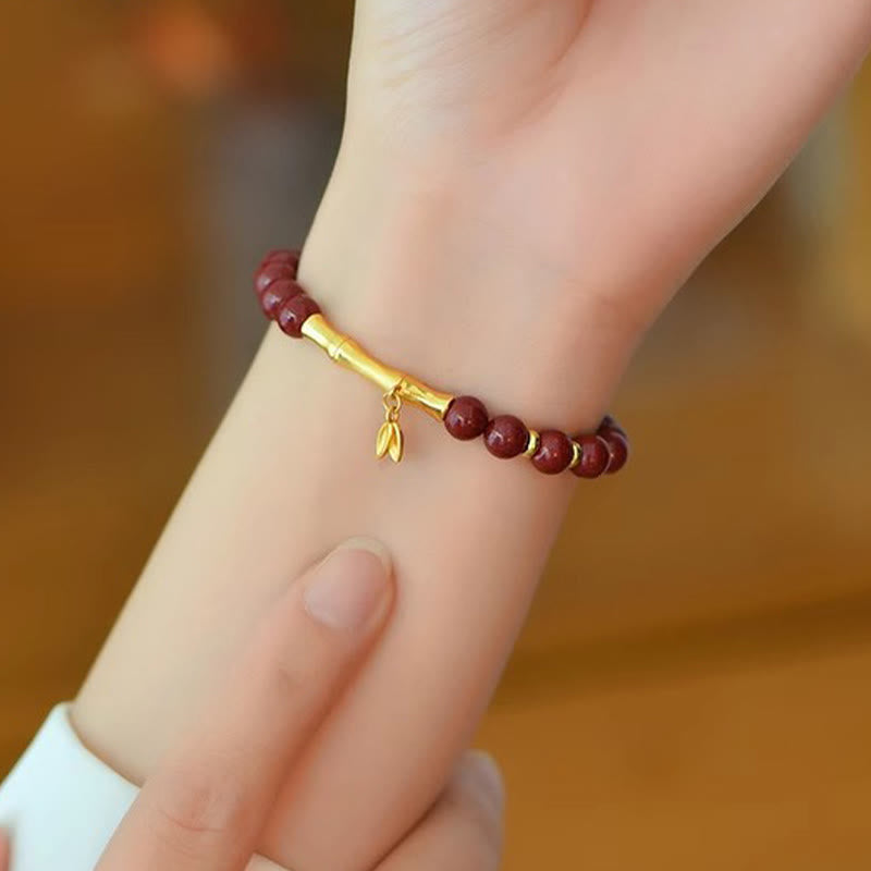 Armband 925 Silber Zinnober Bambus Anhänger getragen am Handgelenk Schutz