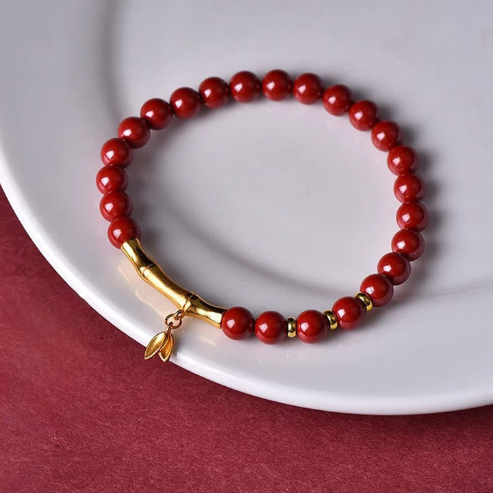 Armband 925 Silber Zinnober Bambus rote Perlen goldener Bambusanhänger Schutz