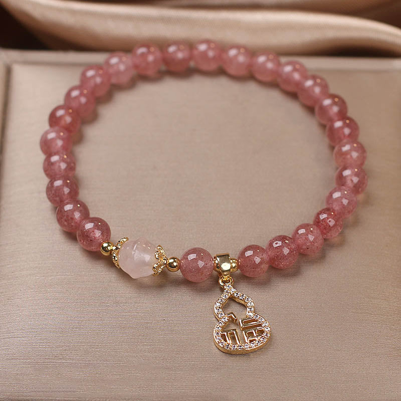Armband Erdbeerquarz Fu-Zeichen rosé Perlen gold Anhänger elegant