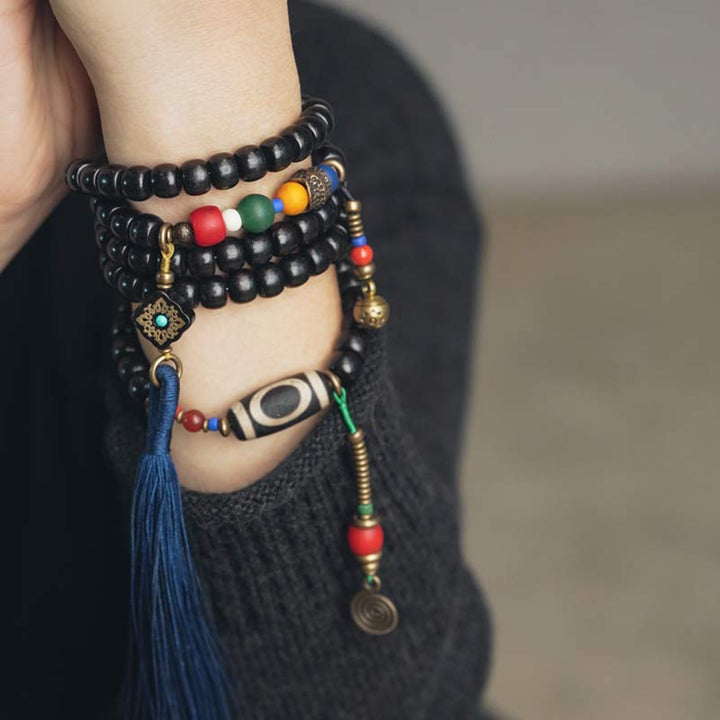 Mala Kupfer Ebenholz – Balance Armband mit bunten Perlen am Handgelenk