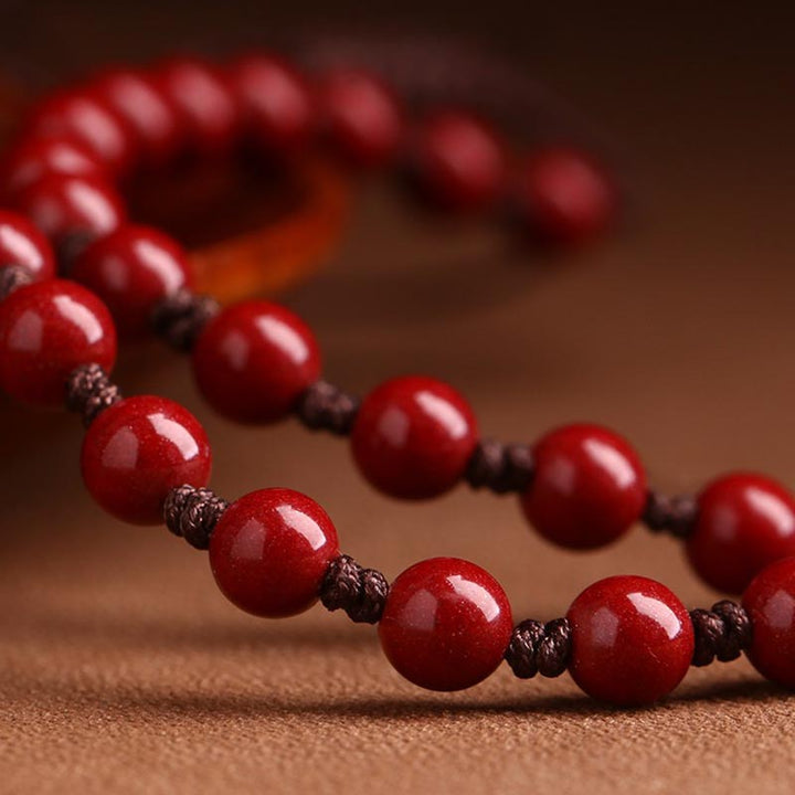 Rotes Zinnober Armband Nahaufnahme Kupfer Drachen Perlen elastisch Wohlstand