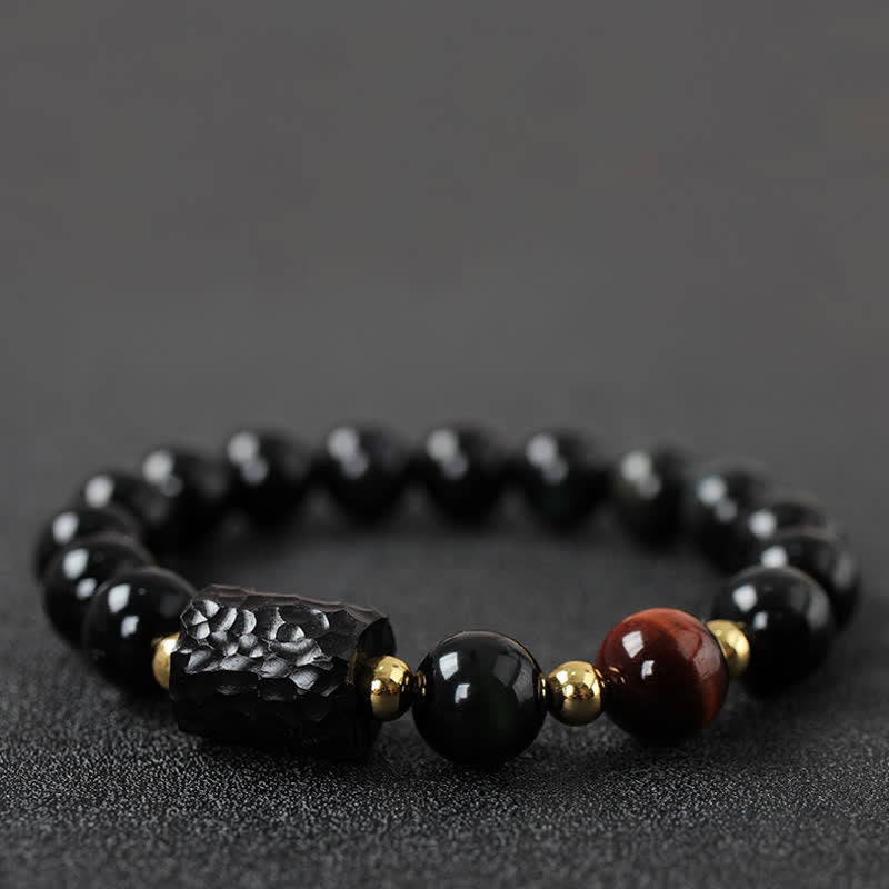 Schwarzer Obsidian Tigerauge Armband mit goldenen Perlen elegant.