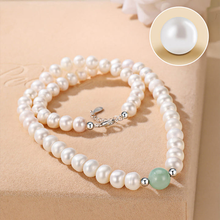 Perlarmband 925 Silber mit weißen Perlen und grünem Jade-Stein elegant.