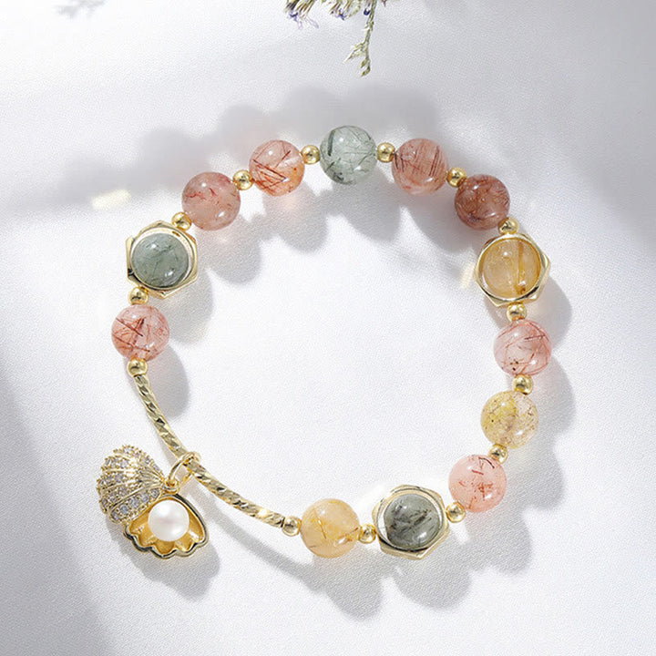 Armband Bunt Rutilquarz Shell Schutz elastisch Naturstein Perlen Gold.