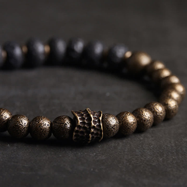 Kupfer Armband mit strukturierten Perlen und Ornament elegant