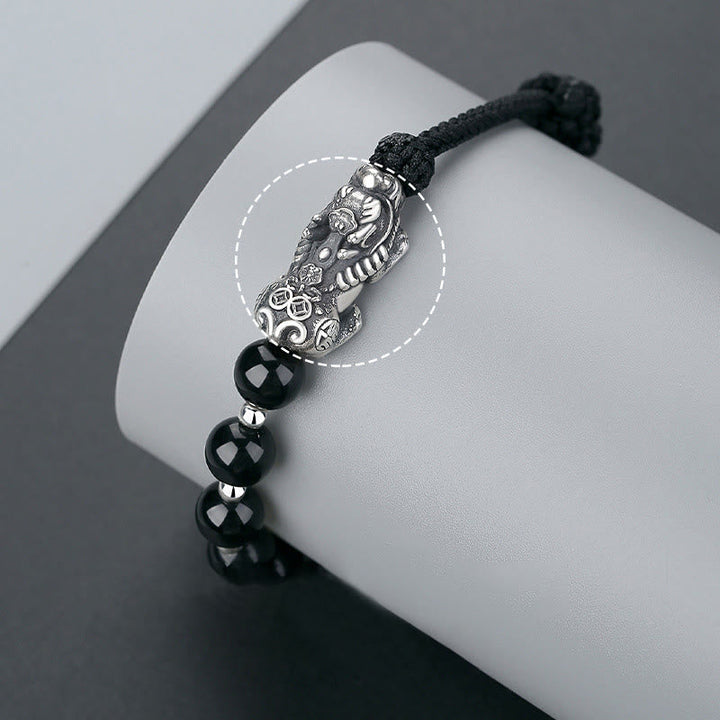 Schwarzes Obsidian Pixiu Armband 925 Silber elastisch am Handgelenk getragen