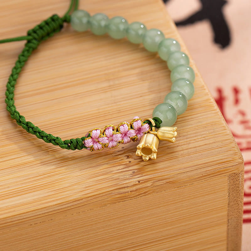 Jade Armband mit rosa Blüten Charm grüne Makramee Schnur