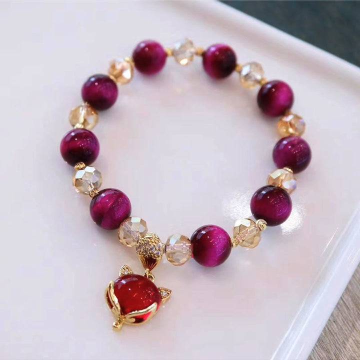 Armband Tigerauge Pixiu mit roten Perlen und goldenen Akzenten eleganter Schmuck
