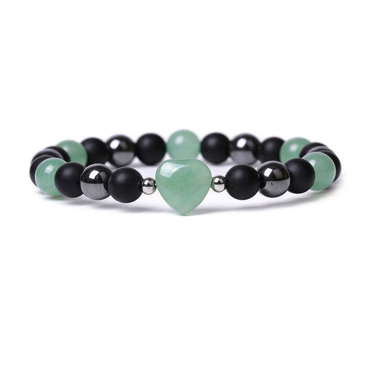 Armband Schwarzer Onyx Tigerauge mit grünem Herz Anhänger elastisch.