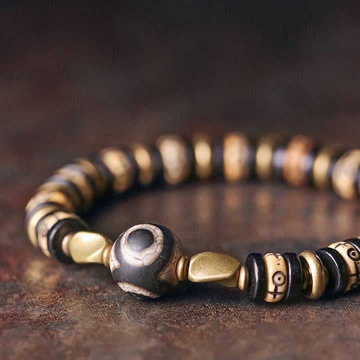 Armband Ebenholz mit goldenen Perlen Stärke und Energie Naturstein