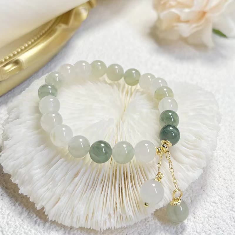 Jade Armband Glück Fülle Balance hellgrüne Naturstein Perlen golden
