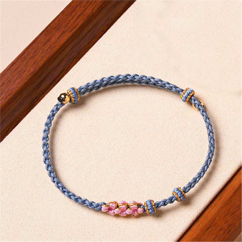 Armband Pfirsichblüte Schutz blaues Seil rosa Perlen elegant