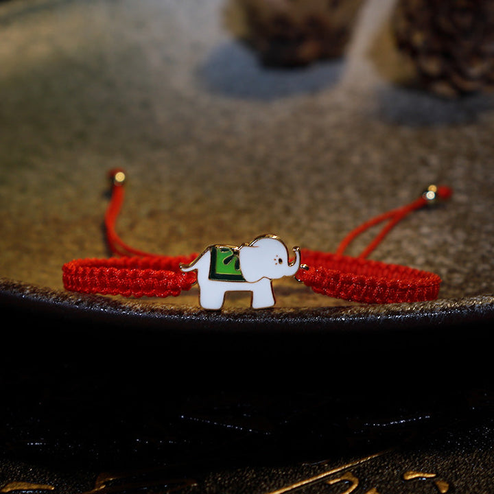 Rotes Armband mit silbernem Elefant Glück Charm elegant.