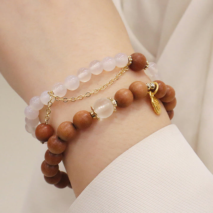 Armband Sandelholz Fu-Zeichen Schutz Rosenquarz Perlen gold elegant