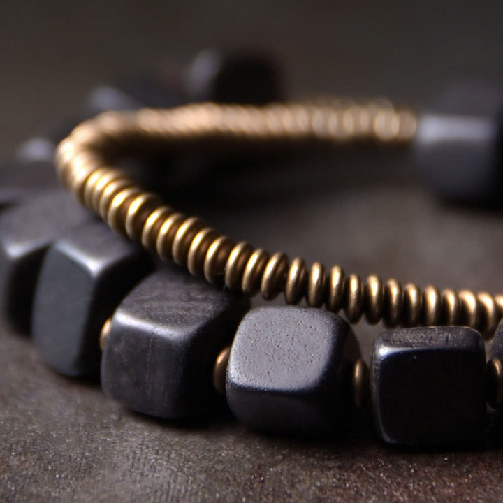 Armband Kupfer Ebenholz Frieden mit metallischen Perlen elegant.