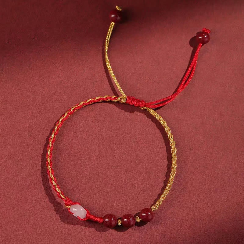 Armband Zinnober Jade – Frieden & Segen rotes goldenes Seil Perlen.