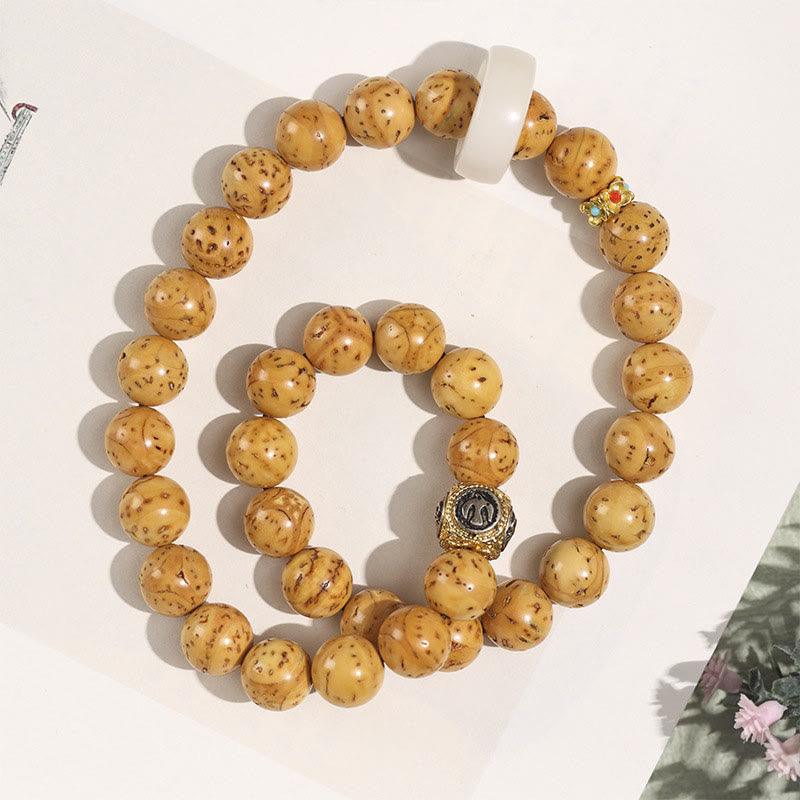 Armband Bodhi – Wohlstand Balance Naturholzperlen mit Metallverzierung elastisch.