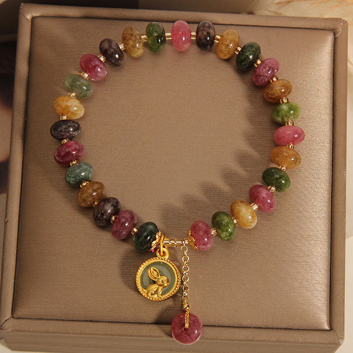 Armband Bunt Tourmaline Hase mit goldenem Anhänger elastisch.