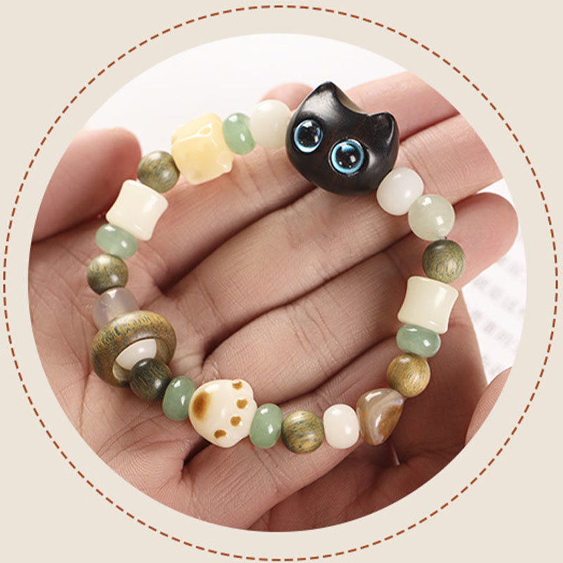 Armband Sandelholz Bodhi Katze Frieden Naturstein elastisch Handgelenk getragen