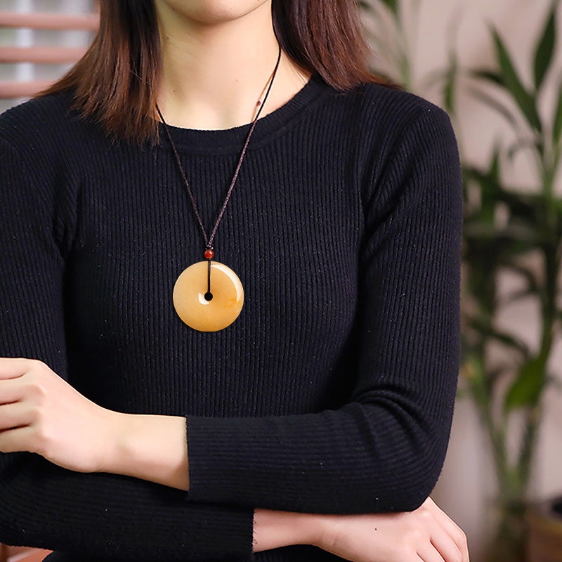 Kette goldene Jade Anhänger rund Naturstein