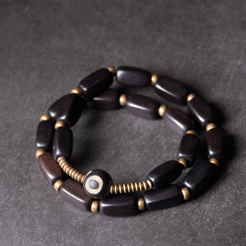 Armband Kupfer Ebenholz Balance schwarze Holzperlen goldene Akzente elegant