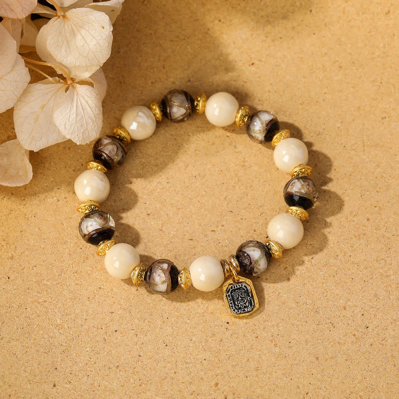 Armband – Schutz & Wohlstand & Balance mit Perlen und bronzefarbenen Perlen elastisch