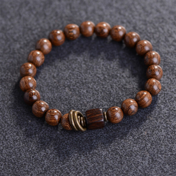 Armband Phoebe Zhennan Holz mit Metallakzent braun Spirituality elastisch