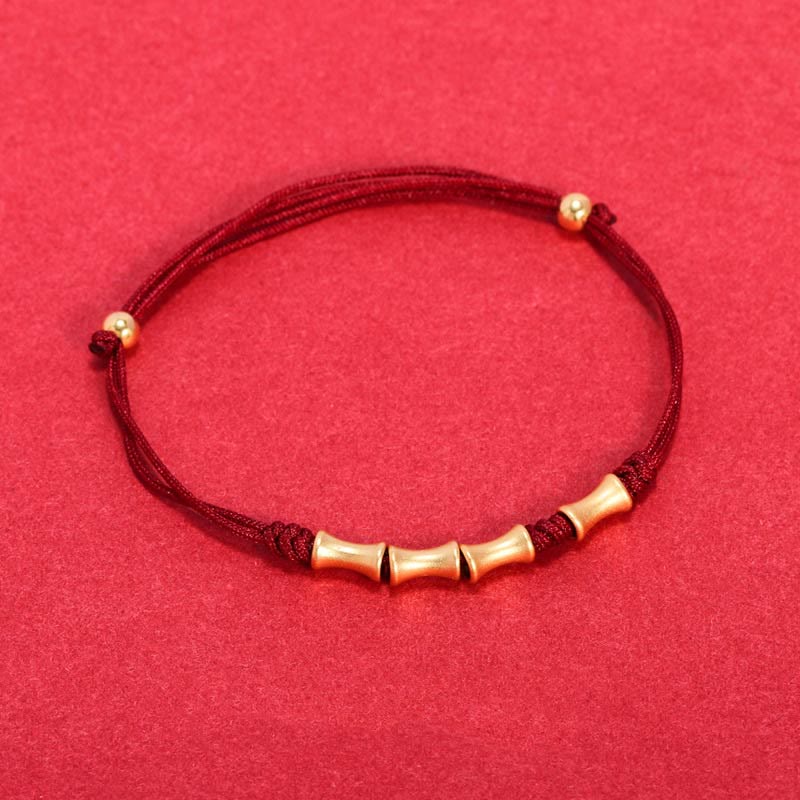 Rotes Armband mit Bambus-Perlen und goldenem 925 Silber Verschluss elegant.