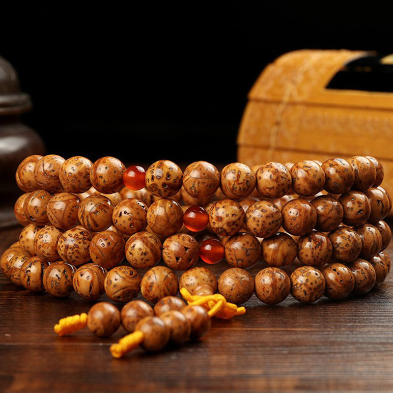 Armband Tibet Bodhi Samen Weisheit braun Holzperlen Naturstein Flachaufnahme