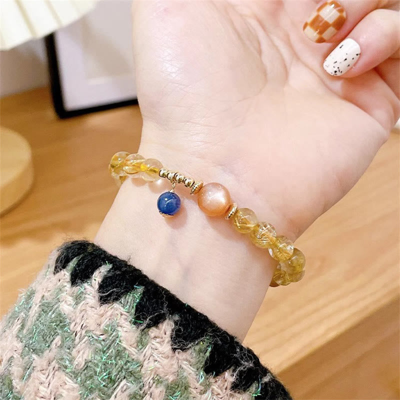 Armband – Wohlstand & Stärke mit gelben Kristallen und blauen Perlen