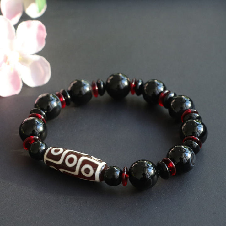 Armband Schwarzer Onyx mit roten Perlen und Tibetischer Perle elegantes Design