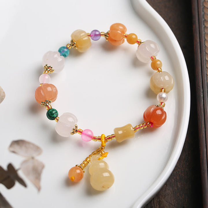 Armband Kristall Jade mit farbigen Steinen und goldenem Zubehör Schale