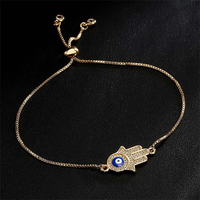 Goldenes Armband Böses Auge – Schutz & Mut mit blauem Stein Flachansicht