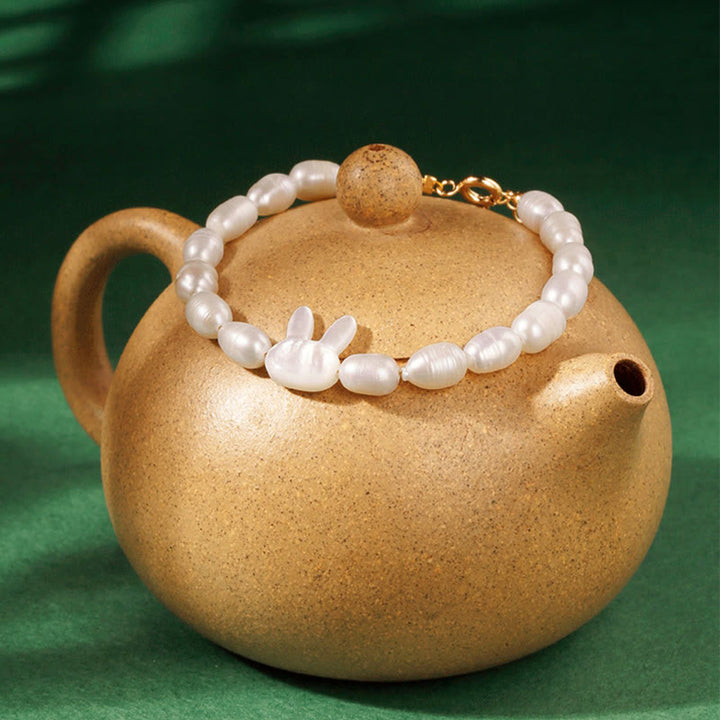 Armband Perle Hase Aufrichtigkeit goldene Keramik Teekanne Dekoration