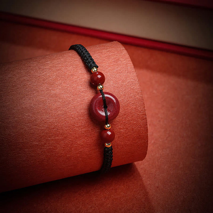 Armband Zinnober – Frieden & Segen rotes Perlenarmband schwarzes Band elegantes Design