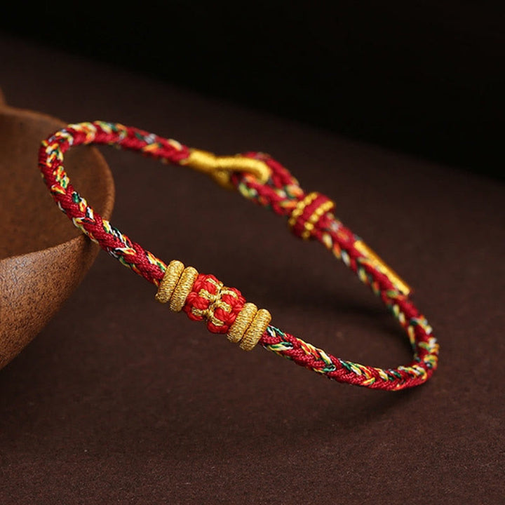 Rotes goldenes geflochtenes Armband Bunt Geflochten Knoten – Glück elegant.