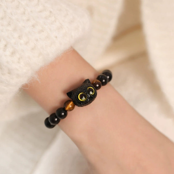 Armband Ebenholz Katze mit goldenen Augen und schwarzen Perlen elastisch