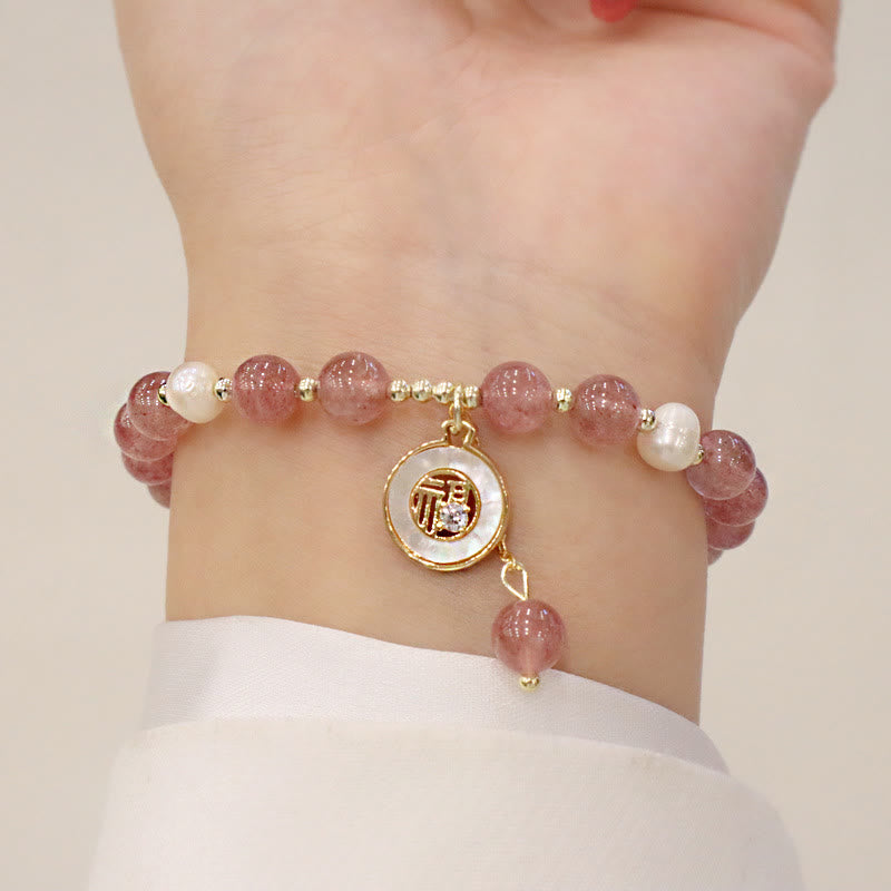 Armband Erdbeerquarz Perle Fu-Zeichen Heilung Handgelenk getragen elegant