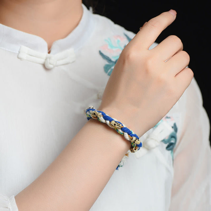 Armband – Glück & Wohlstand & Harmonie in Blau und Gold geflochten