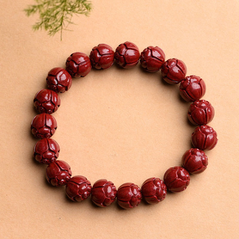 Zinnober Armband mit Om Mani Padme Hum Perlen rot glänzend elastisch