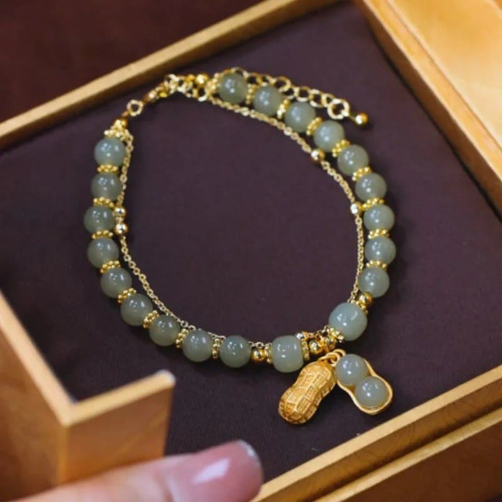 Jade Armband mit Fu-Zeichen Anhänger goldene Perlen Glück