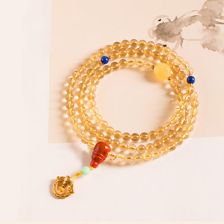 Mala Armband aus goldenem Citrin mit rotem Achat Anhänger.