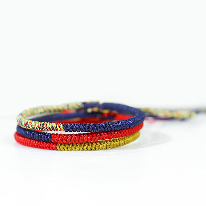 Armband Tibet bunt geflochten Knoten Schutz elastisch mehrfarbig.