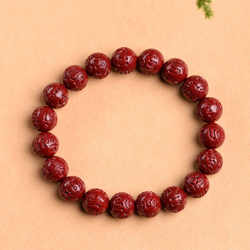 Rotes Zinnober Armband mit Om Mani Padme Hum Gravuren elastisch