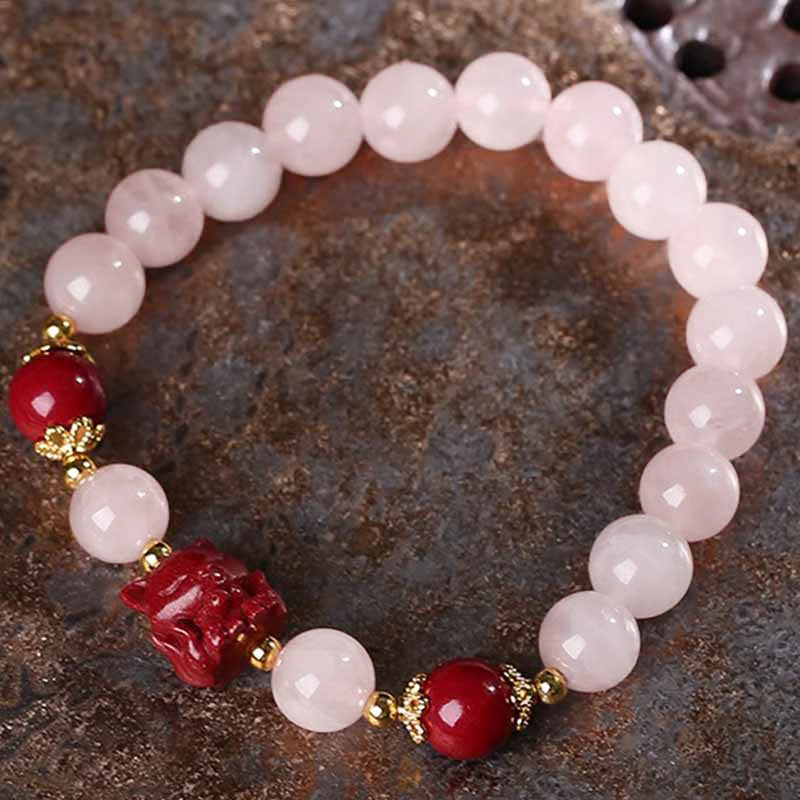Rosenquarz Armband mit roten Zinnober Kristall Perlen elegant.