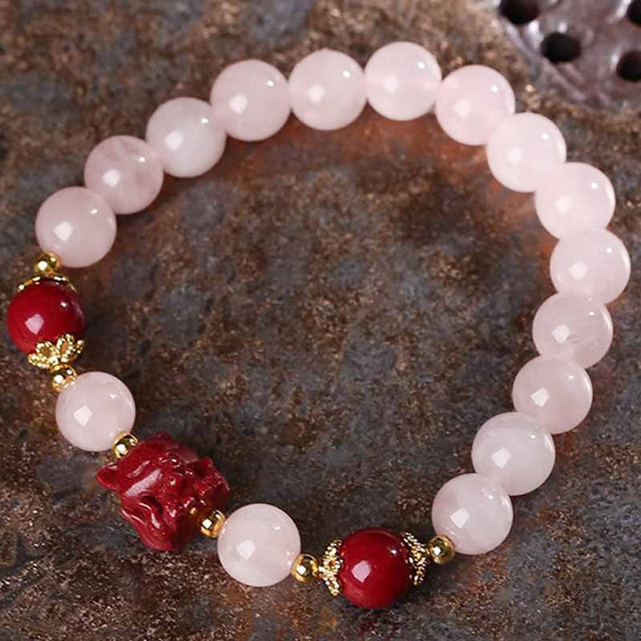 Rosenquarz Armband mit roten Zinnober Kristall Perlen elegant.